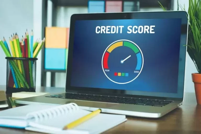 Image of a laptop with the credit score meter on the screen.